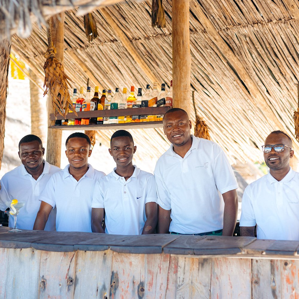 Bar team at Cristal Resort serving drinks by Paje Beach, Zanzibar.